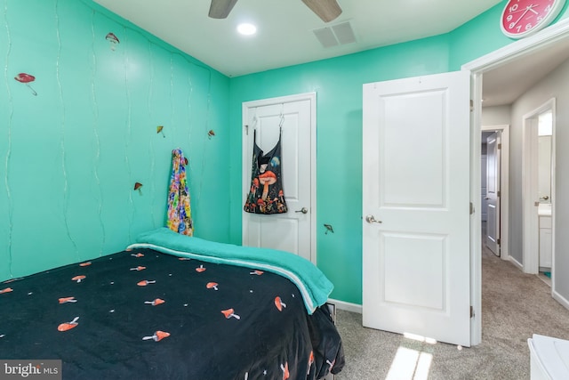 bedroom featuring ceiling fan and carpet