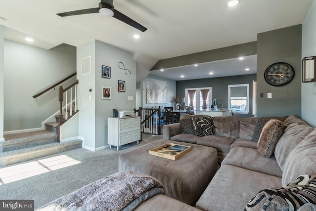 living room with ceiling fan and light carpet