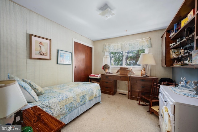 bedroom with light colored carpet