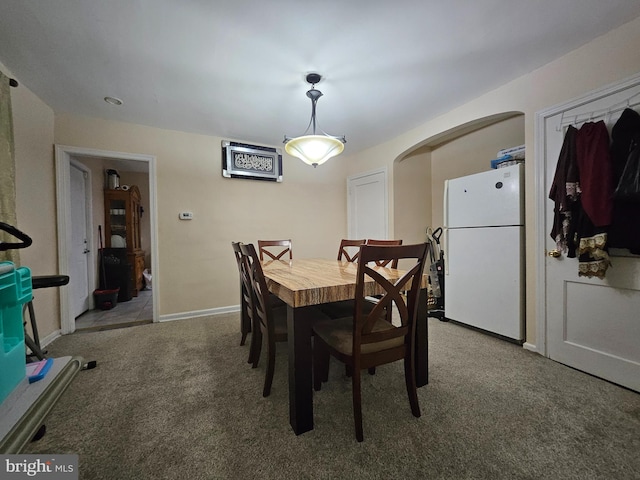 view of carpeted dining room