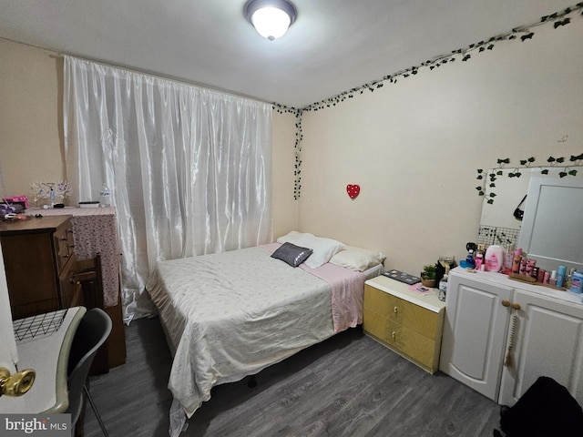 bedroom featuring dark wood-type flooring