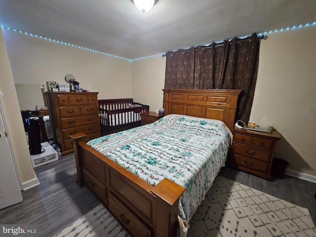 bedroom featuring dark hardwood / wood-style floors