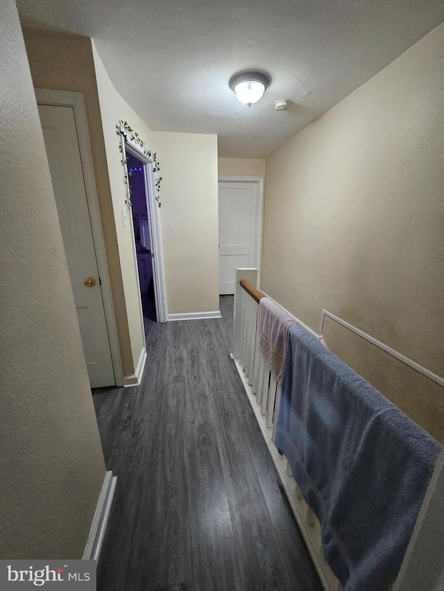 hallway featuring dark hardwood / wood-style floors