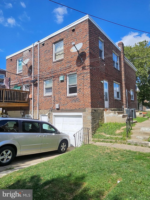 view of side of home featuring a garage