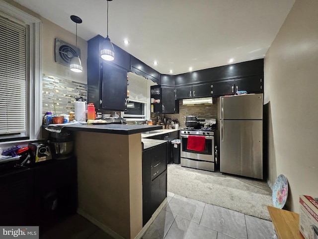 kitchen with light carpet, appliances with stainless steel finishes, tasteful backsplash, hanging light fixtures, and kitchen peninsula