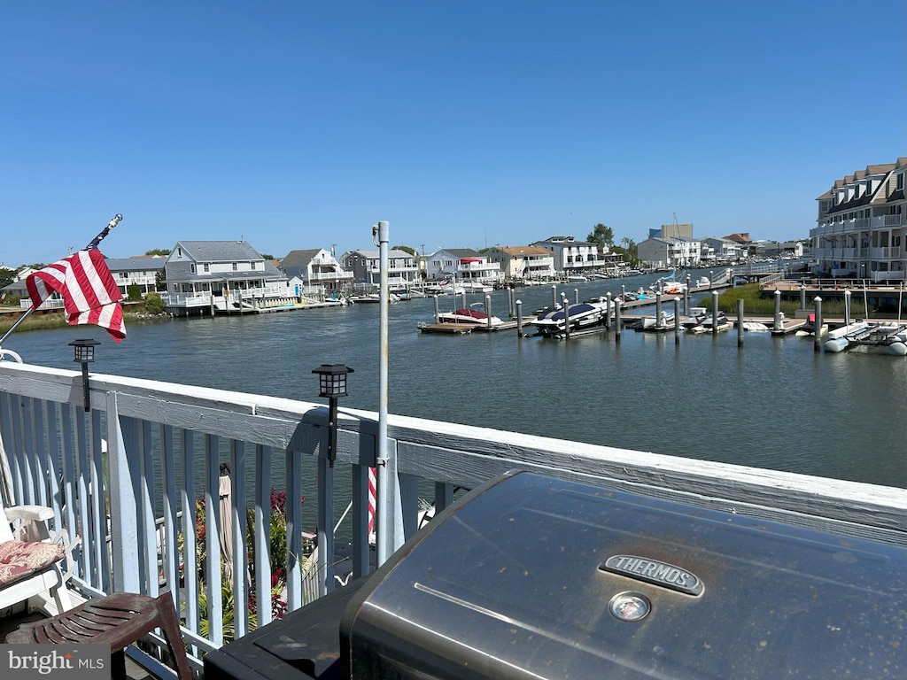 property view of water featuring a boat dock