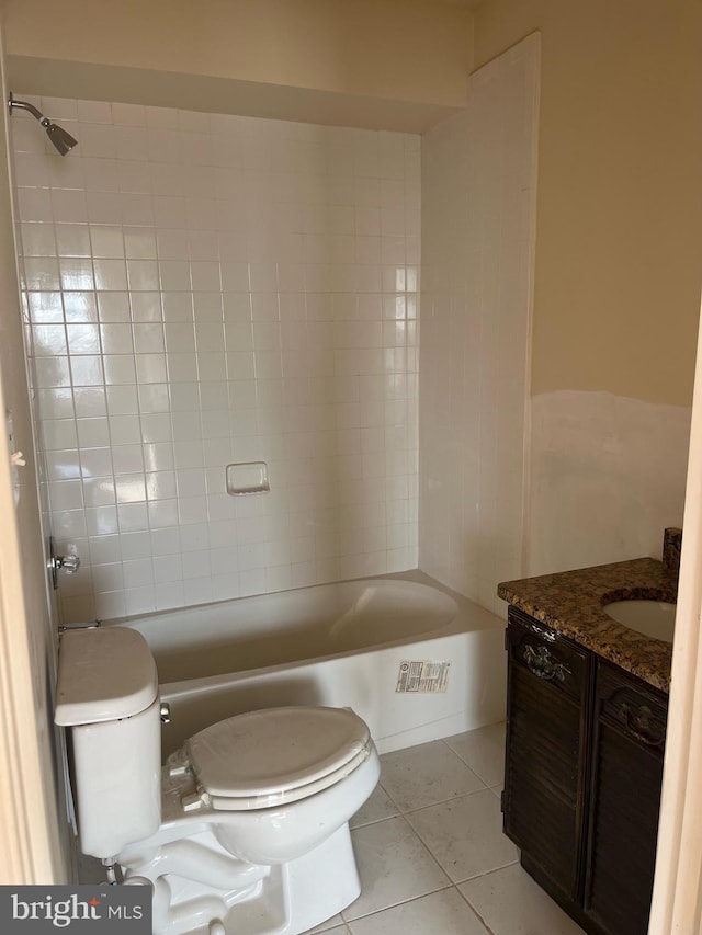 bathroom featuring tile patterned floors, toilet, tub / shower combination, and vanity