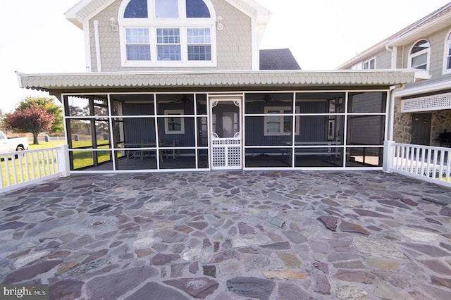 view of front of home with a sunroom