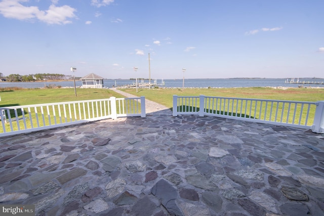 view of patio with a water view