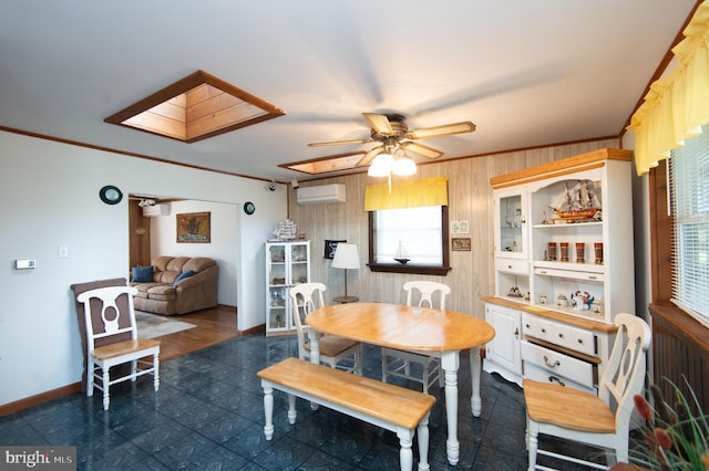 dining space featuring a wall unit AC, a skylight, a ceiling fan, and ornamental molding