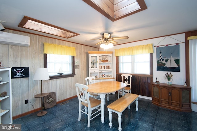 dining room with a wealth of natural light, visible vents, wood walls, and a wall unit AC