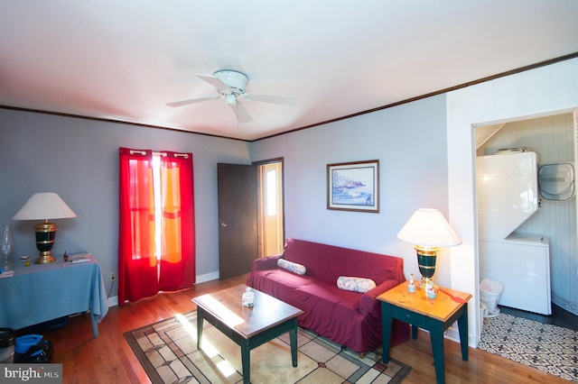 living area featuring crown molding, wood finished floors, and ceiling fan