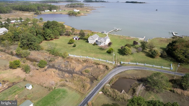 birds eye view of property featuring a rural view and a water view