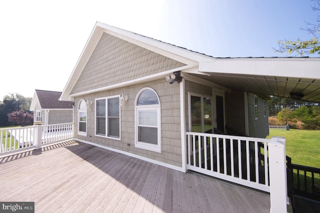 deck featuring a lawn