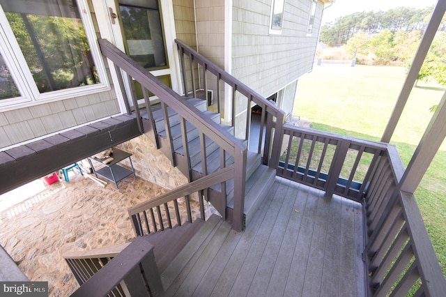 wooden deck with stairs and a yard