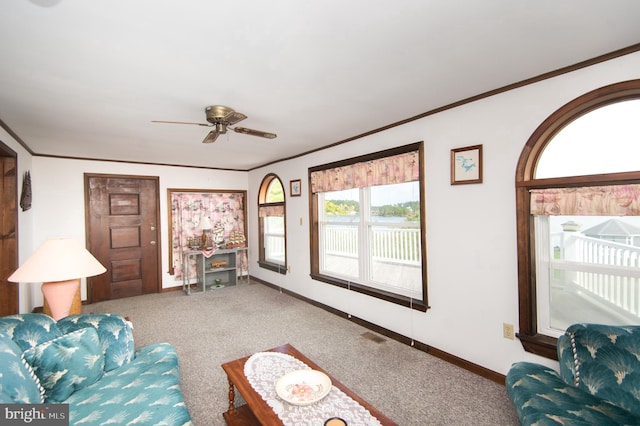 living room featuring baseboards, carpet floors, and ornamental molding