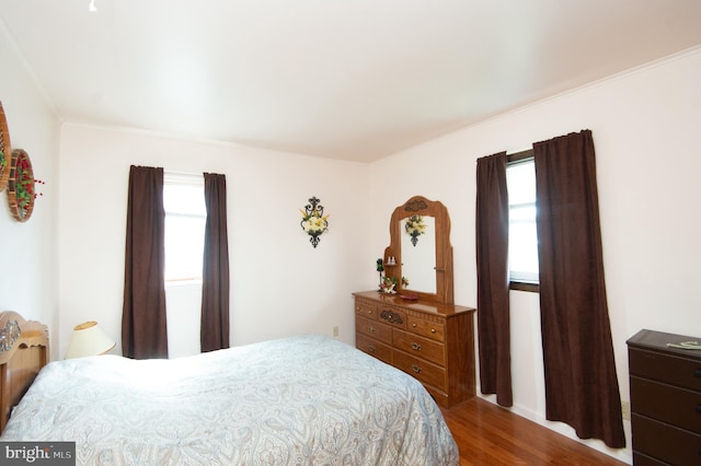 bedroom featuring wood finished floors