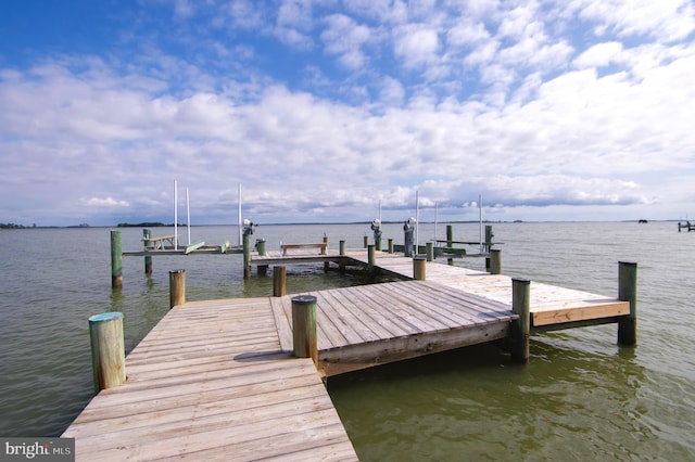 view of dock featuring a water view and boat lift