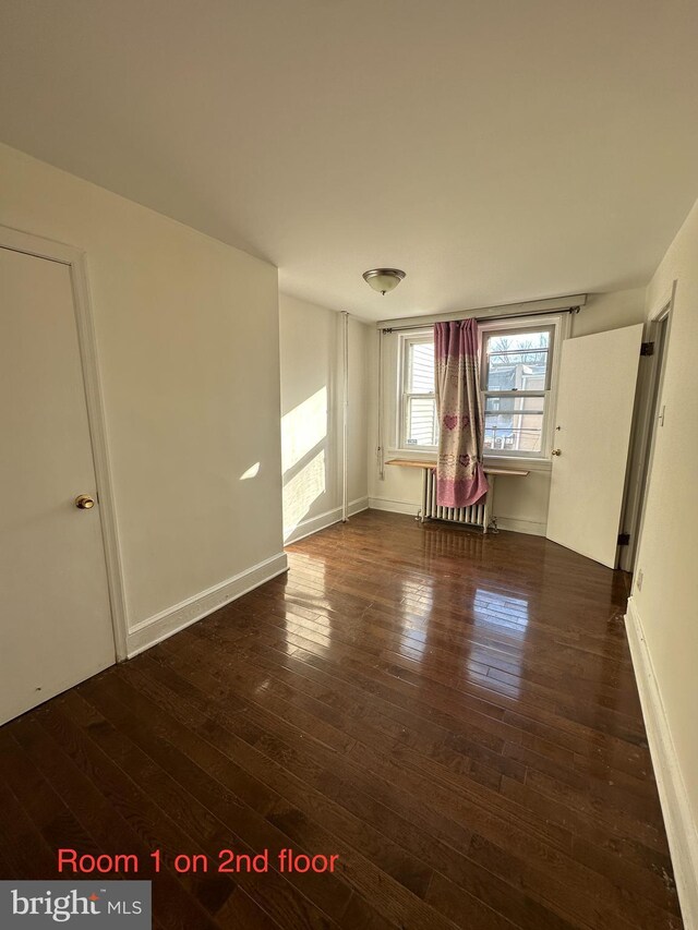 stairs with wood finished floors and baseboards