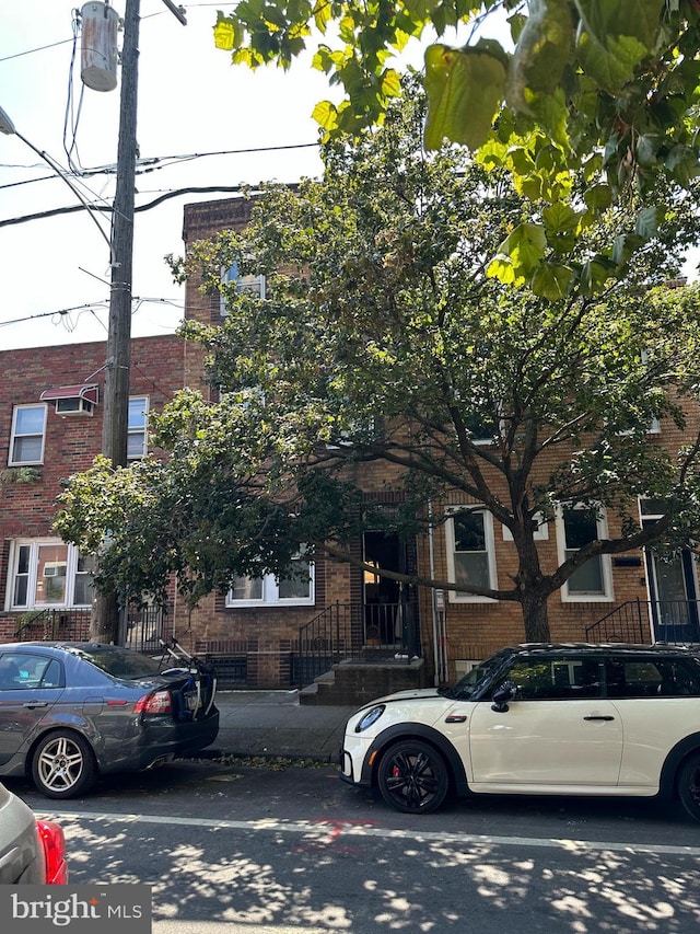 view of front of home featuring brick siding