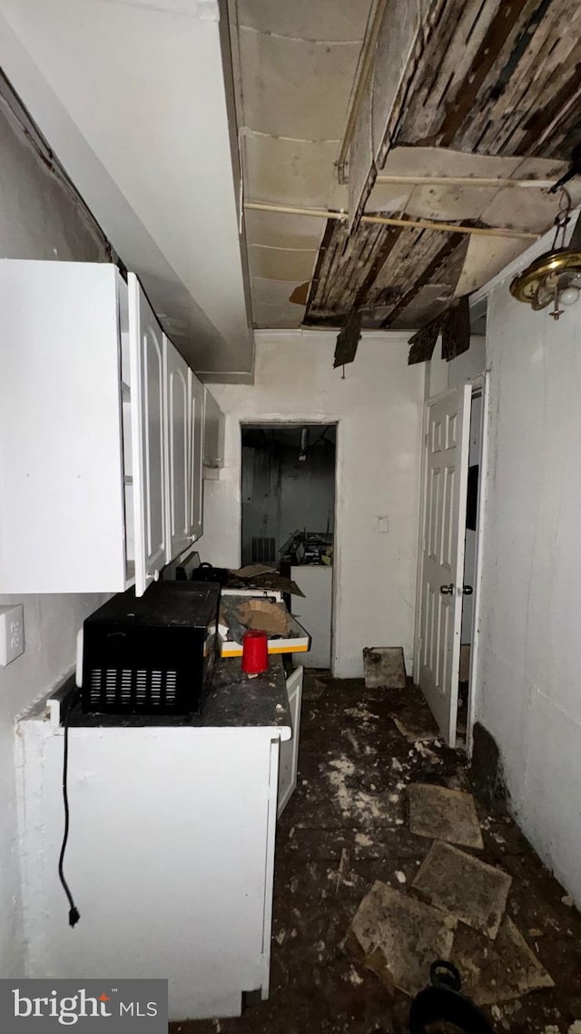 kitchen featuring white cabinets