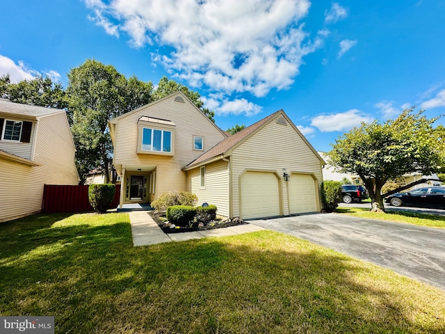 front of property with a front yard and a garage