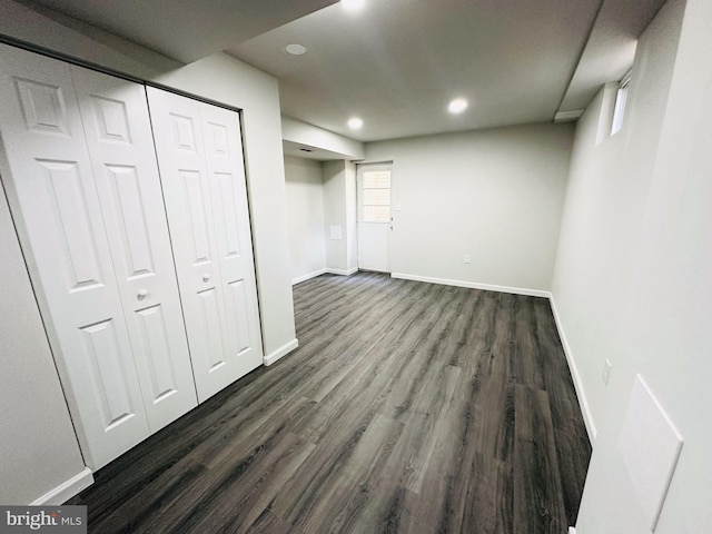 basement featuring dark wood-type flooring