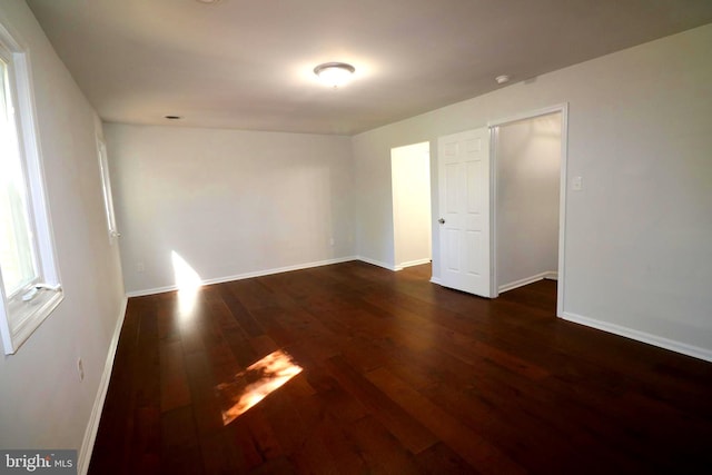 spare room featuring dark hardwood / wood-style floors