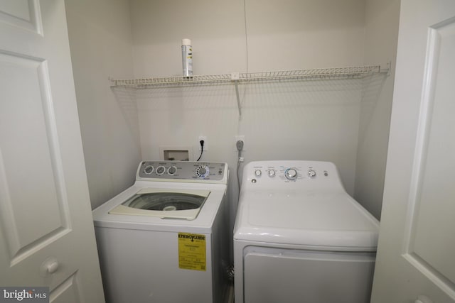 washroom featuring separate washer and dryer