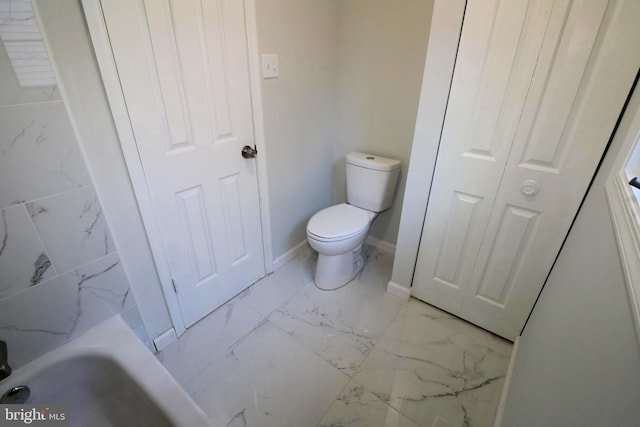 bathroom with a bath and toilet