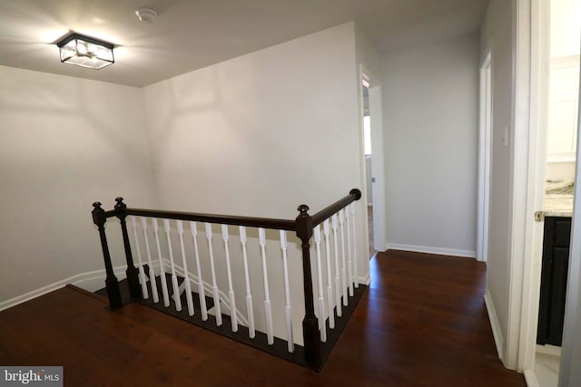 stairs featuring wood-type flooring