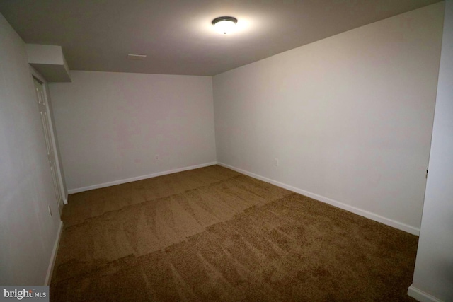 unfurnished room featuring carpet flooring