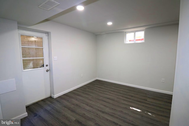 basement featuring dark hardwood / wood-style flooring