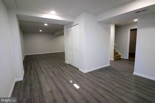 basement featuring dark wood-type flooring