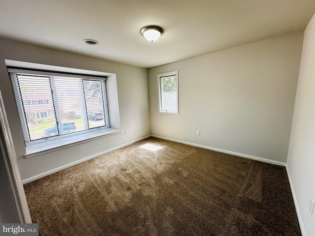 empty room featuring carpet flooring