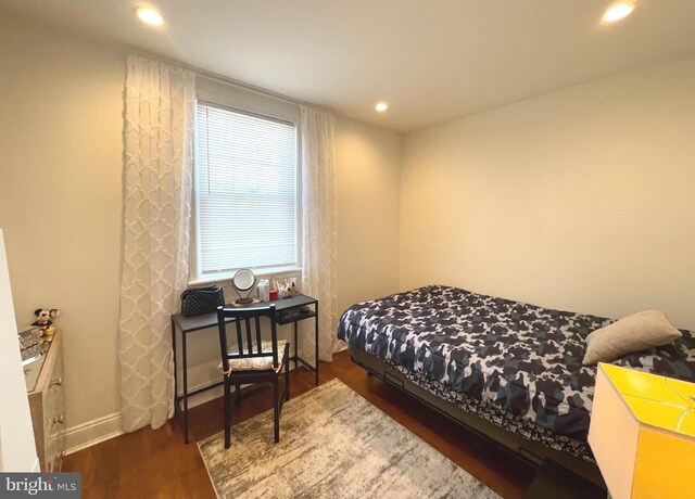 bedroom featuring dark hardwood / wood-style flooring