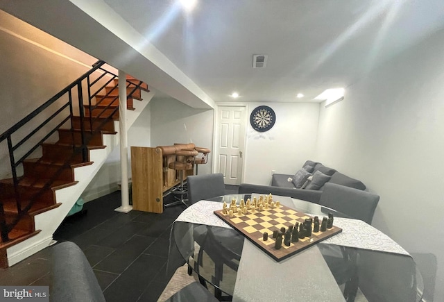 interior space featuring dark tile patterned flooring