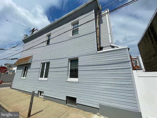 view of side of home with a patio area