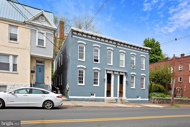 view of front of home featuring brick siding