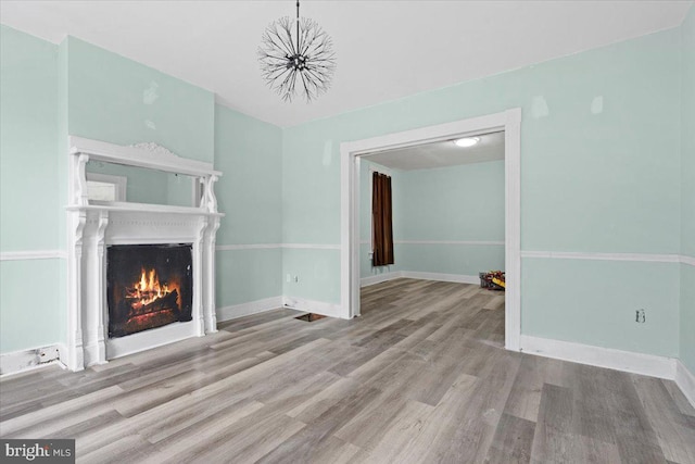 unfurnished living room with light hardwood / wood-style flooring