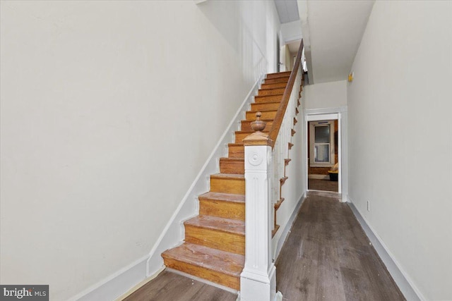 staircase featuring hardwood / wood-style floors