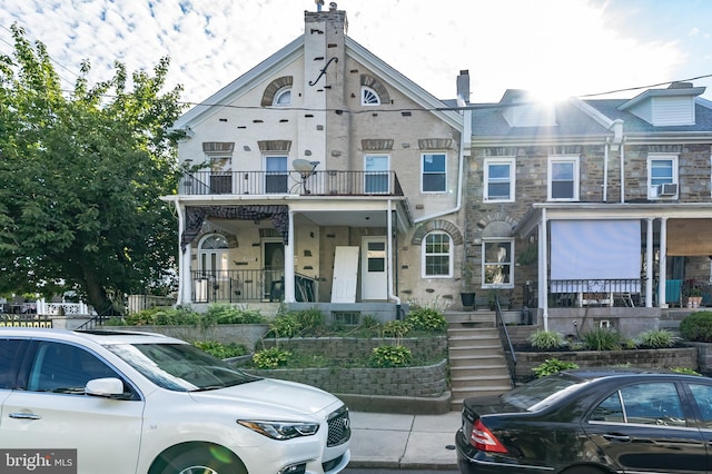 view of property featuring covered porch