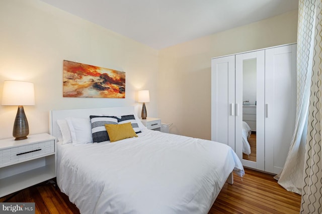 bedroom featuring dark hardwood / wood-style flooring