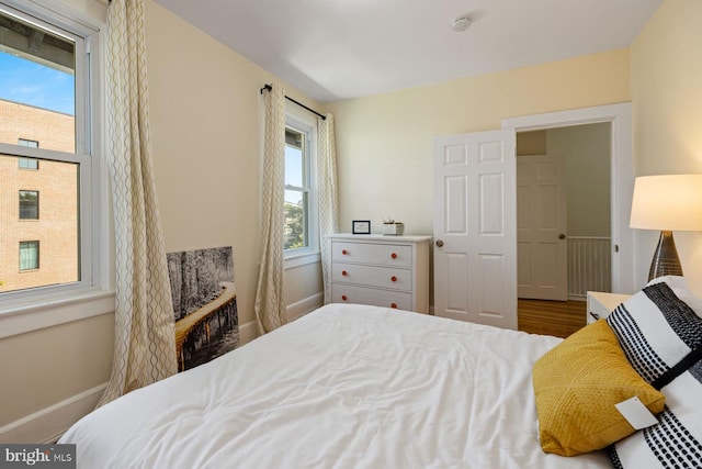 bedroom with hardwood / wood-style floors