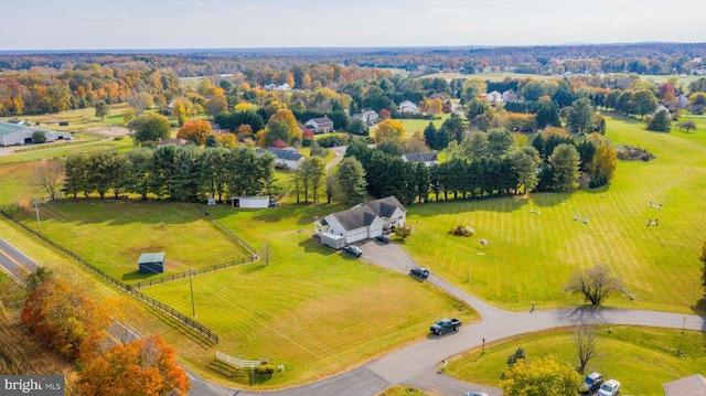 birds eye view of property with a rural view