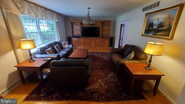 living room with light hardwood / wood-style flooring