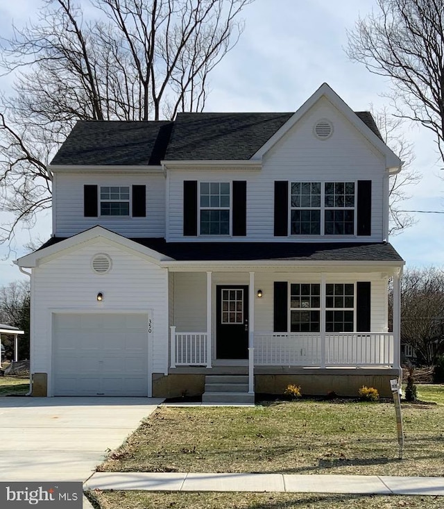 traditional-style house featuring a porch and driveway