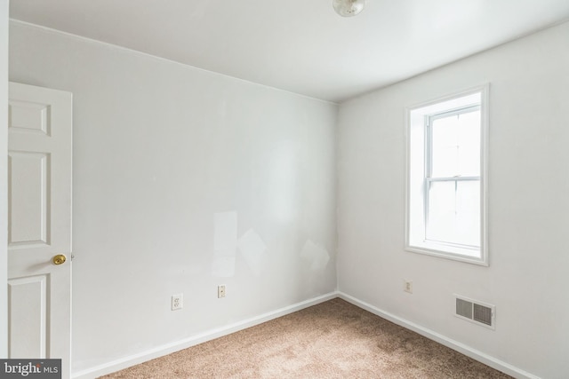 empty room with carpet flooring