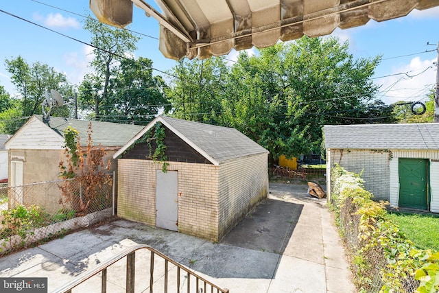 view of patio / terrace featuring a storage shed