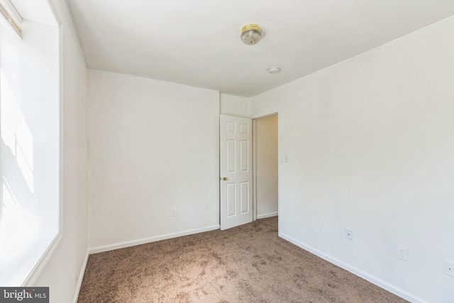 view of carpeted spare room